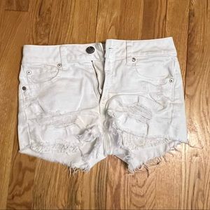 Distressed white shorts
